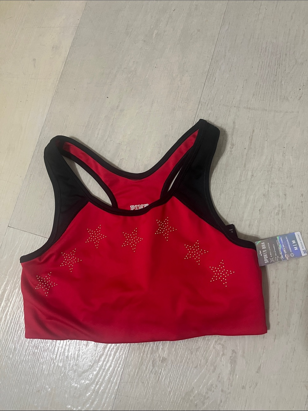 PINK Victoria's Secret Red Sports Bra with Black Trim and Star Studs